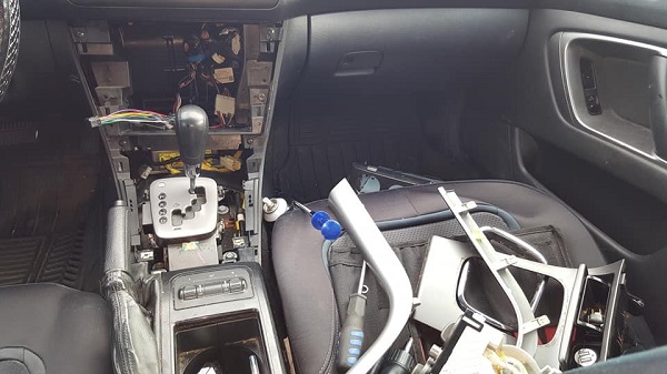 Car console panels removal for bluetooth radio installation